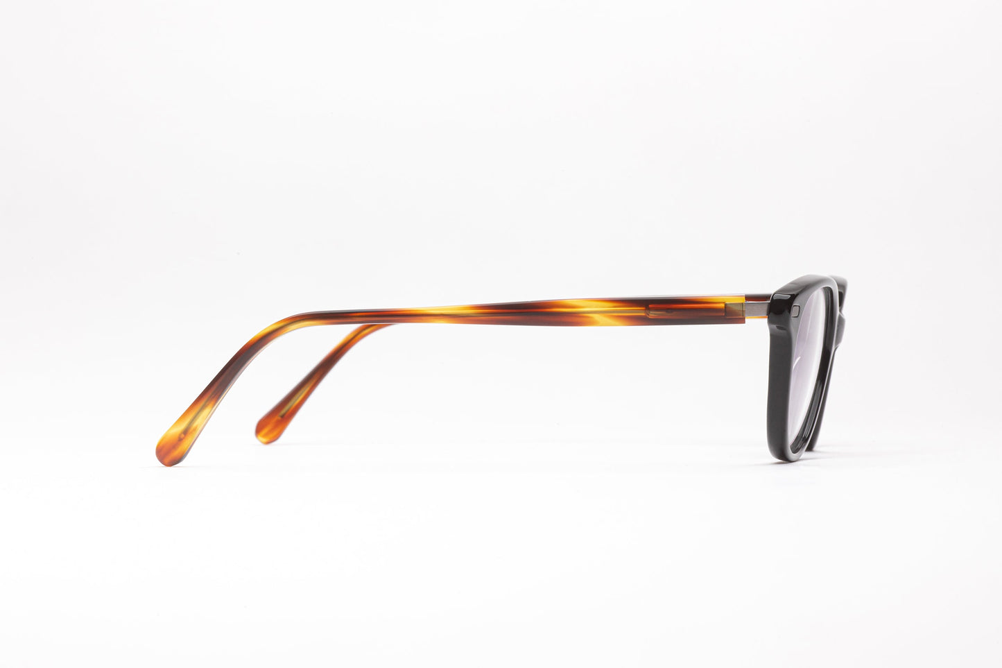 Side view of The Seeker black cateye glasses with tortoiseshell stems