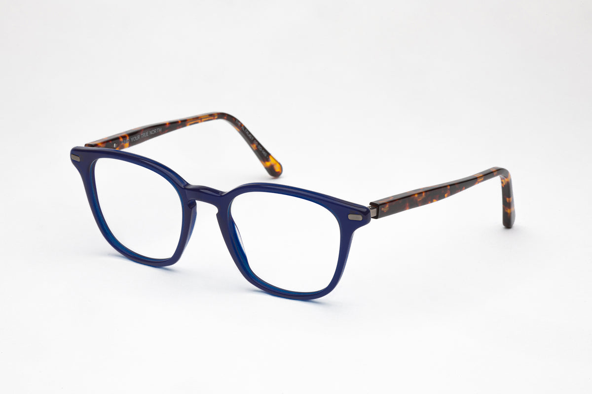 Angled View - The Altruist | Square Designer Prescription Glasses with Low Nose Bridge - Blue Frames with Tortoiseshell Stems