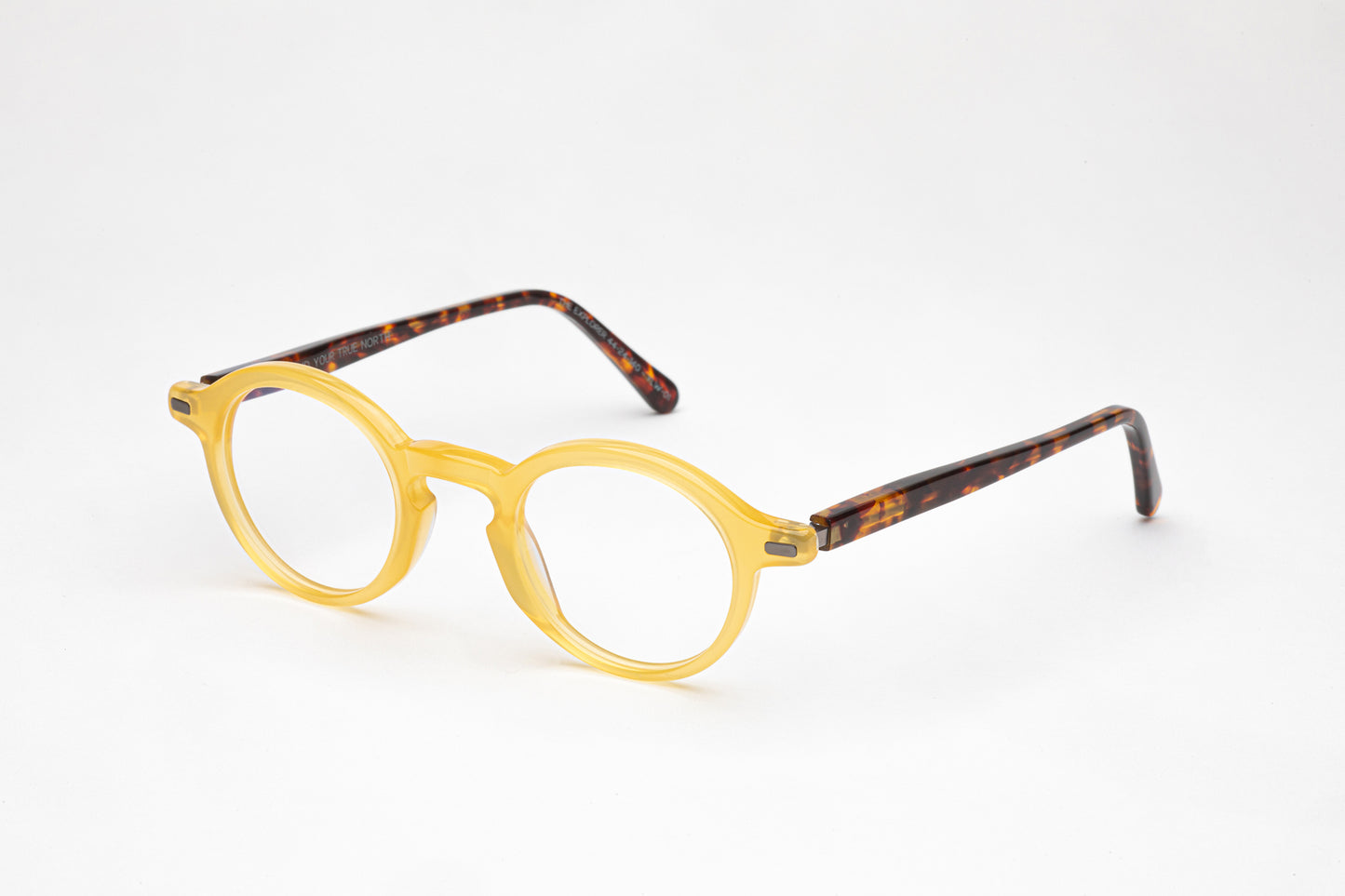 Angled view of The Explorer yellow glasses with tortoiseshell stems